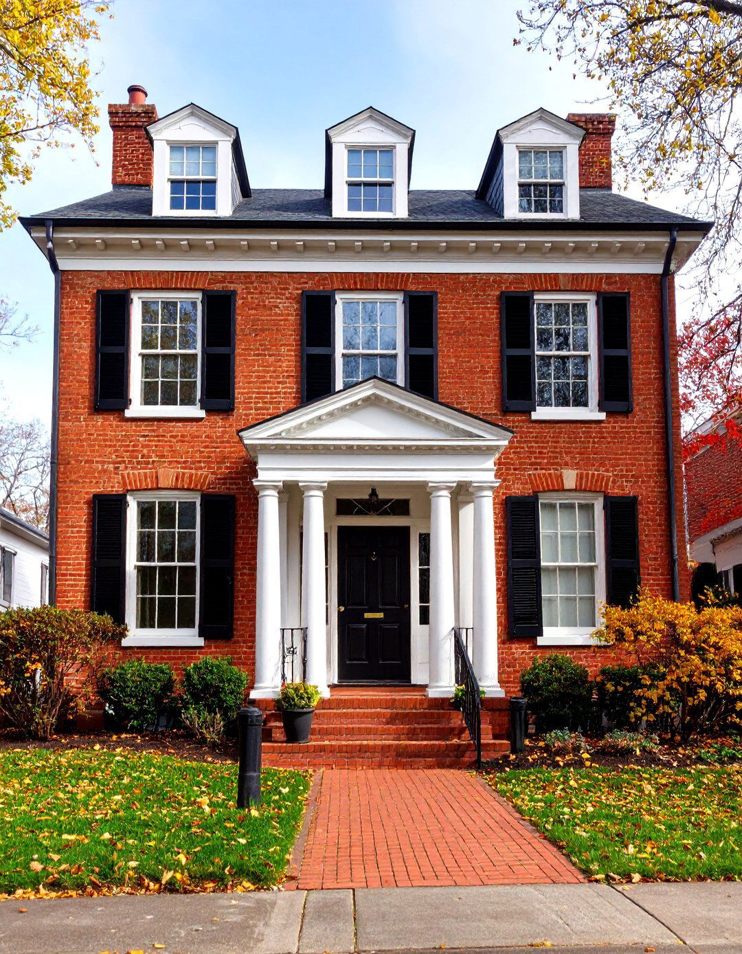 Georgian Style White Brick with Black Window Frames and Door - 24 Black and White House Exterior Ideas