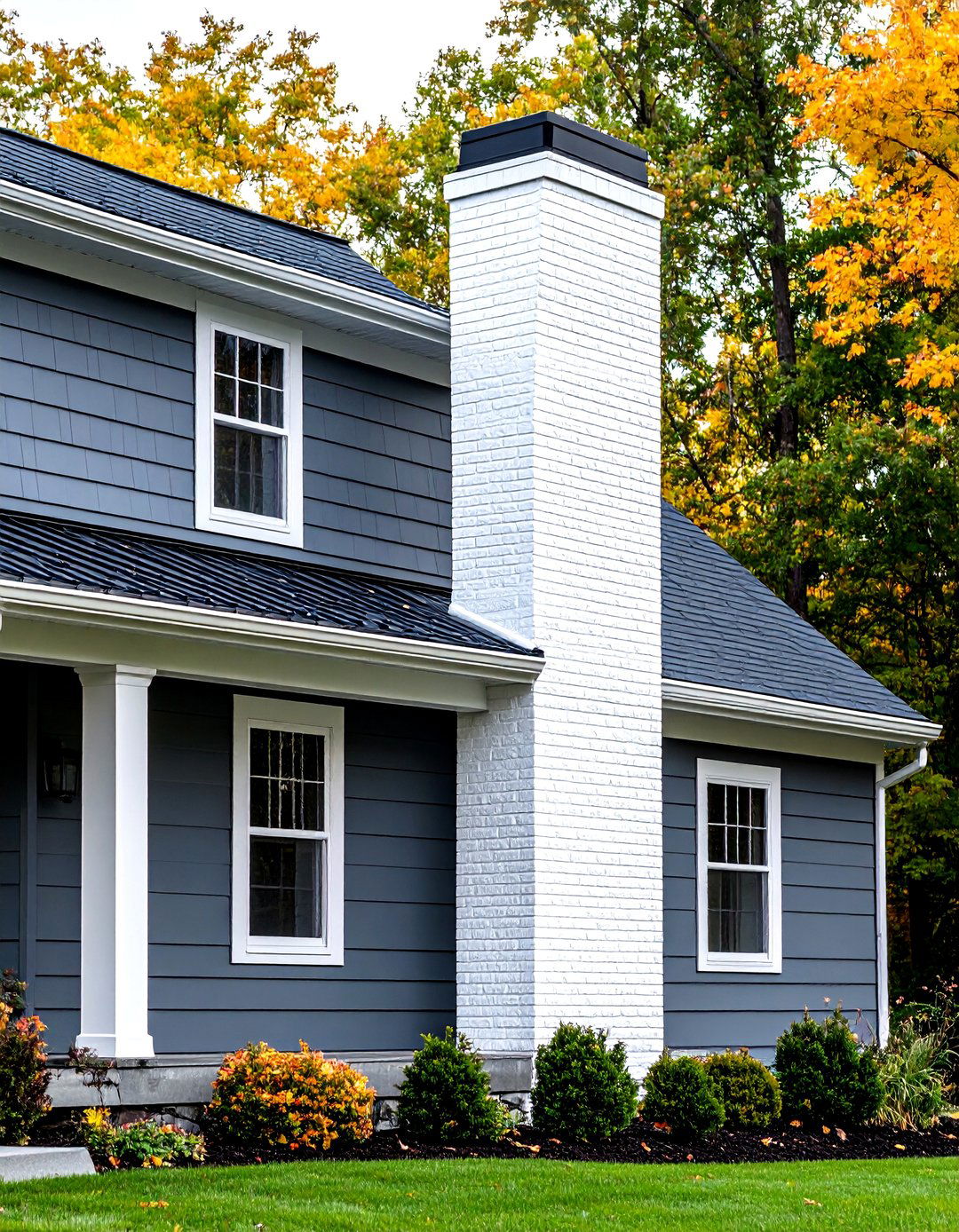 Gunmetal Grey Siding with White Brick Chimney - 24 Dark Grey House Exterior Ideas