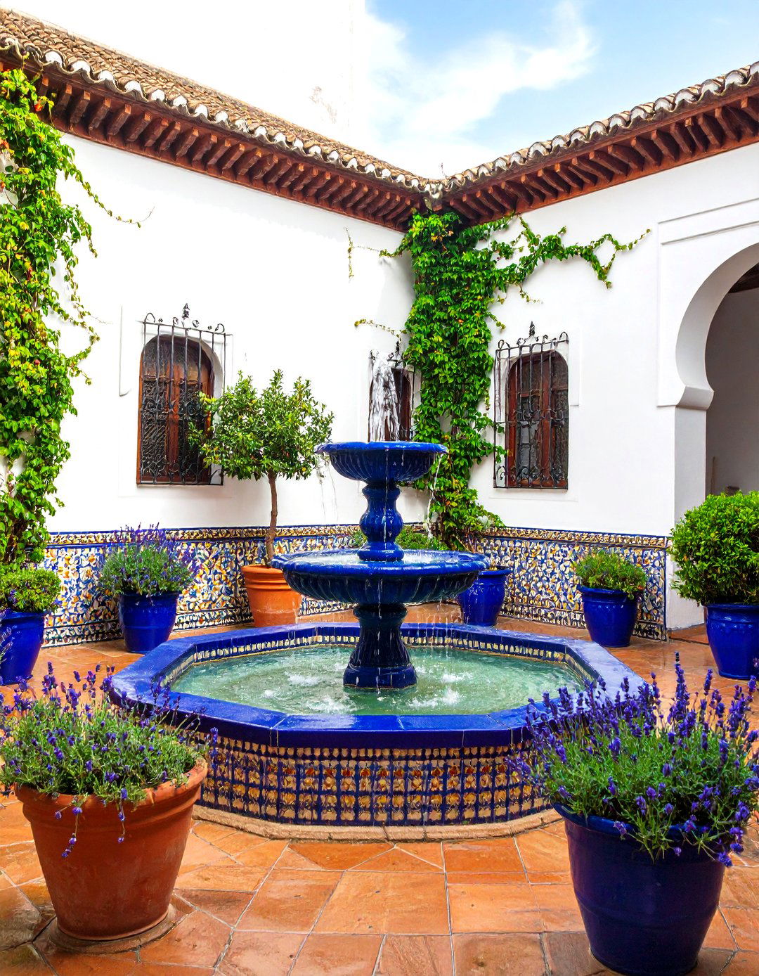 Traditional Andalusian Courtyard with Central Fountain - 24 Spanish Courtyard Ideas