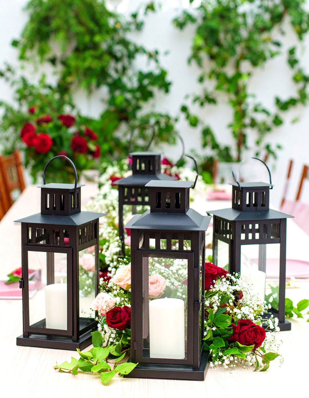 Vintage Black Metal Lanterns with Rose Arrangements - 24 Lantern Centerpiece Ideas